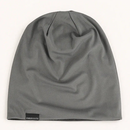 Dark gray lightweight slouchy beanie hat showing the long crown and natural fabric folds
