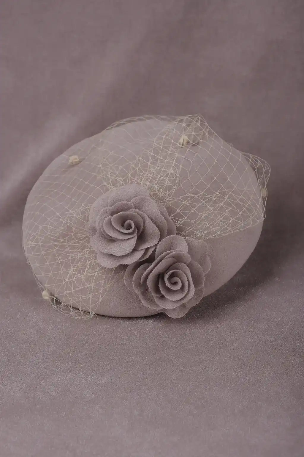 Vintage dusty pink pillbox fascinator hat with roses and netting