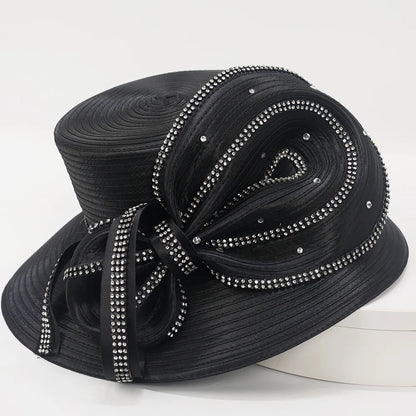 Side angle of an elegant women’s black church hat with sculptural satin bow and crystal embellishments.