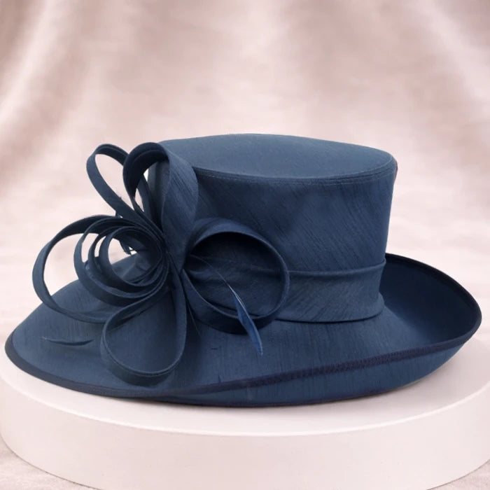 Elegant navy blue wedding hat for women with floral details, ideal for formal occasions and garden parties