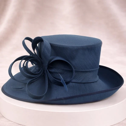Elegant navy blue wedding hat for women with floral details, ideal for formal occasions and garden parties