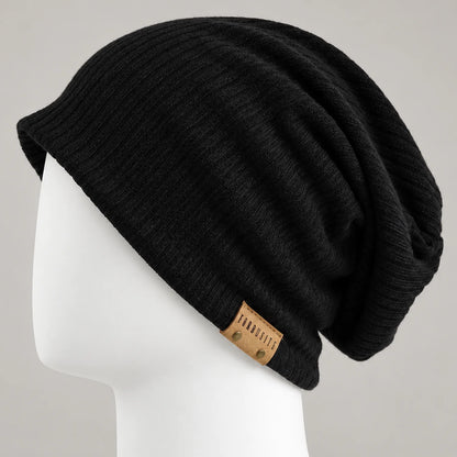 Black knit slouchy beanie with leather side detail and relaxed draped back