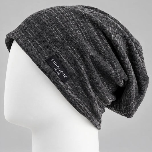 Charcoal patterned slouchy beanie with soft draped back on a mannequin head