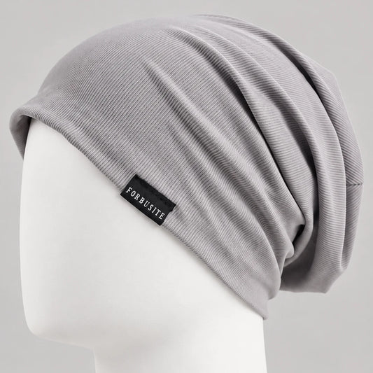 Light gray slouchy beanie with fine ribbed texture and soft relaxed draped back