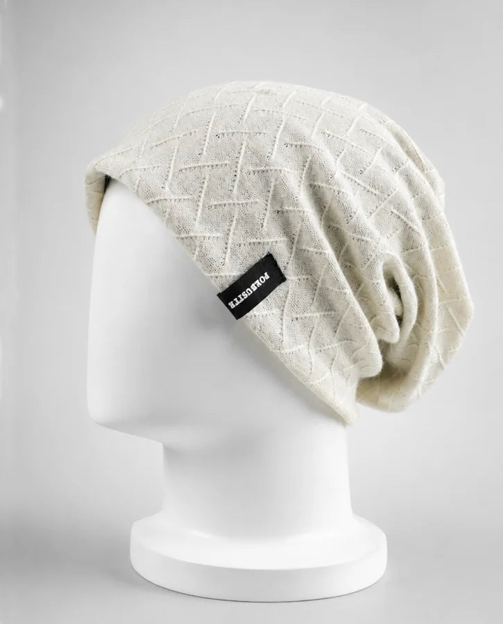 Beige FORBUSITE slouchy beanie with smooth lined interior and relaxed shape