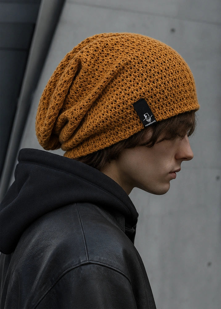 Mustard yellow long slouch beanie cap with loose oversized shape, soft knit texture and casual unisex style
