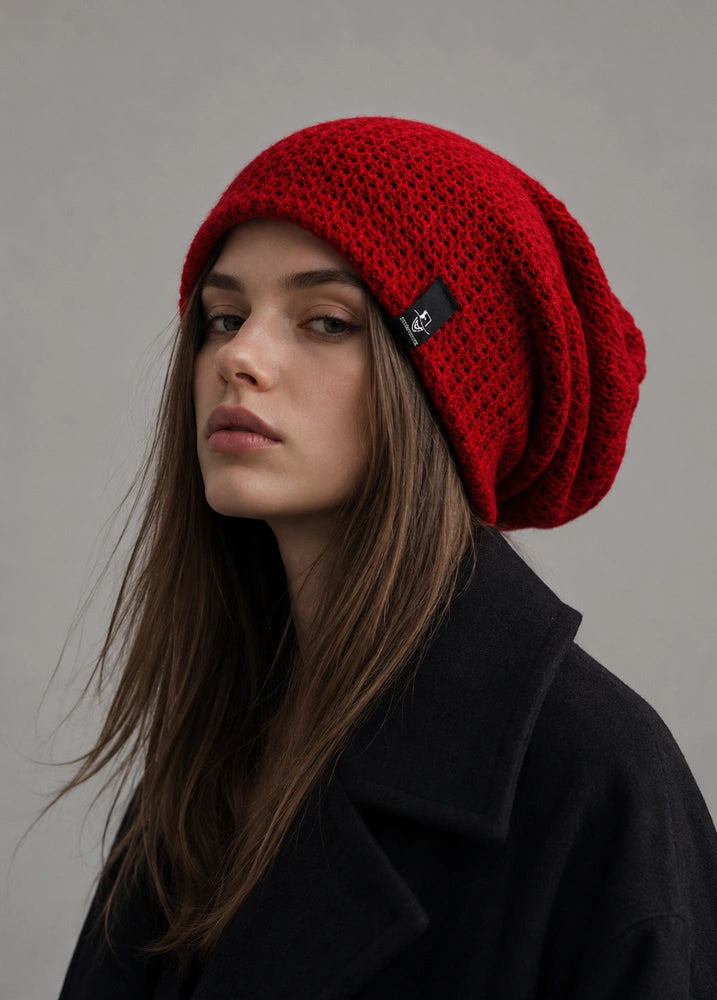 Red slouchy beanie for women with oversized knit fit, relaxed back drape and casual winter streetwear style