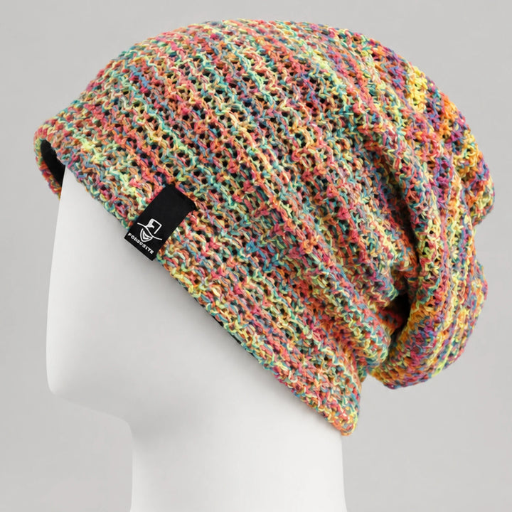 Multicolor knit slouchy beanie with open textured pattern and relaxed oversized drape