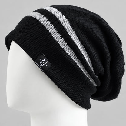 Black slouchy beanie with two white stripes and a relaxed back on a white mannequin.