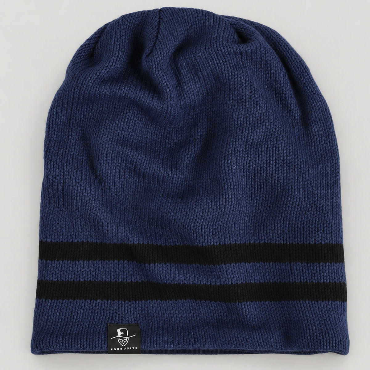 Navy B318 beanie laid flat, showing two black stripes and the small side label.