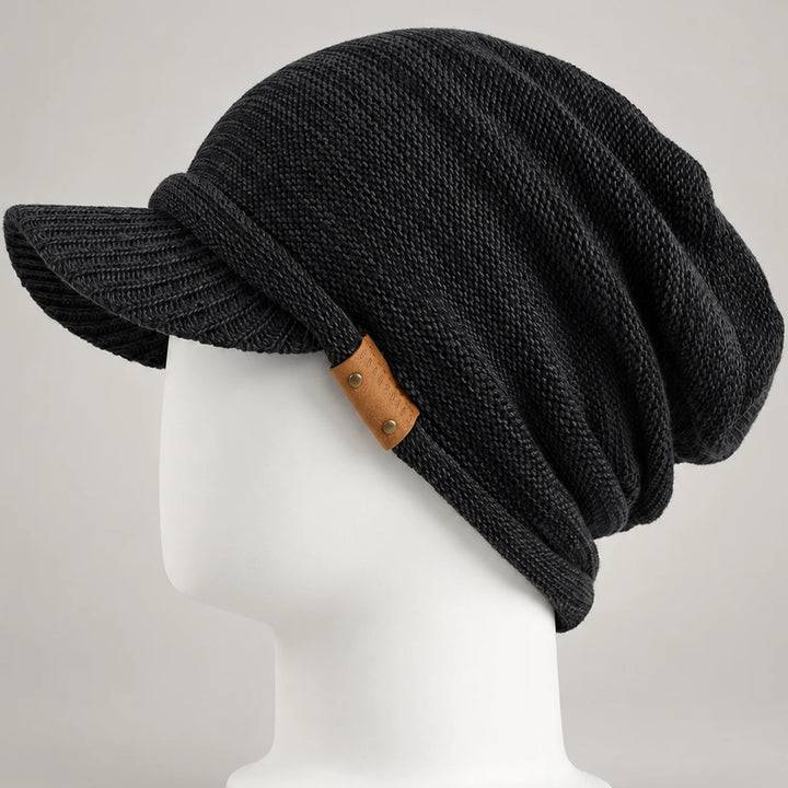 Black knit visor beanie with short brim, leather side detail and relaxed crown