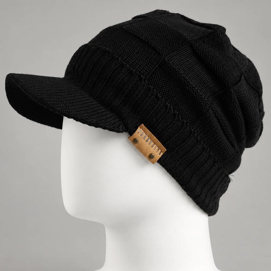 Black knit visor beanie with short brim and textured crown on a mannequin head