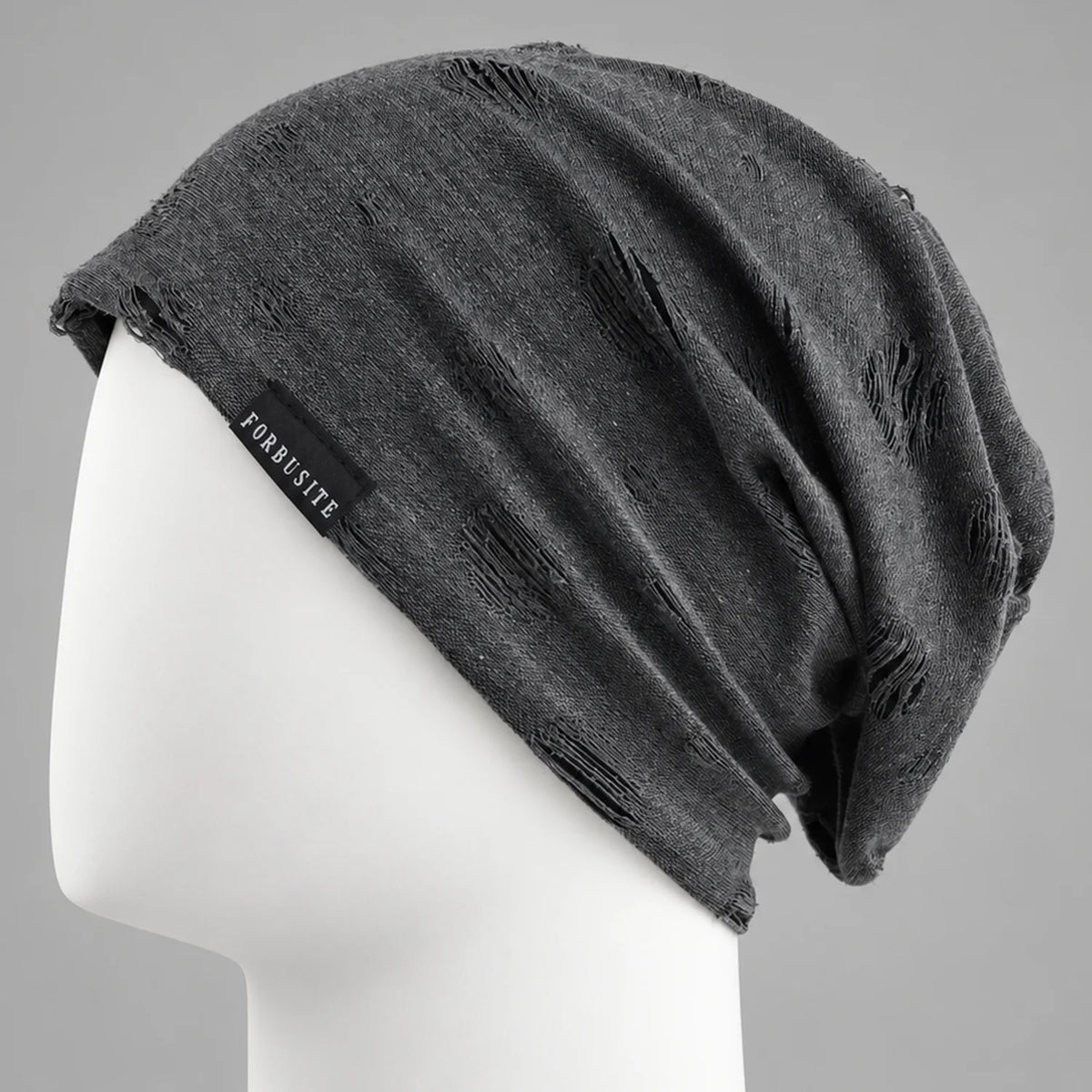 Black distressed slouchy beanie with cutout details and relaxed oversized fit