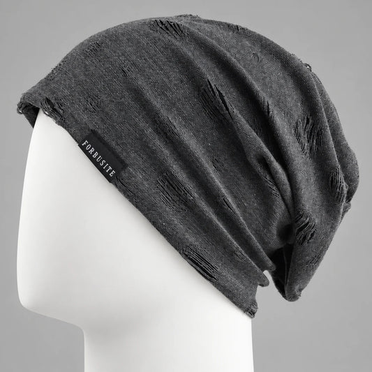 Black distressed slouchy beanie with cutout details and relaxed oversized fit