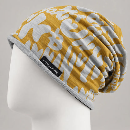 Yellow and white graphic slouchy beanie with relaxed draped back on a white mannequin head