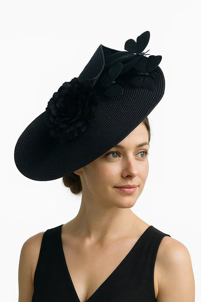 Black fascinator with matching black flower and butterfly accents