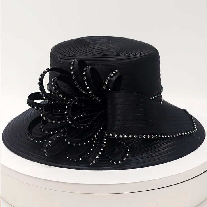 Stylish black church hat with intricate crystal detailing, featuring a decorative ribbon design, ideal for weddings and special occasions.