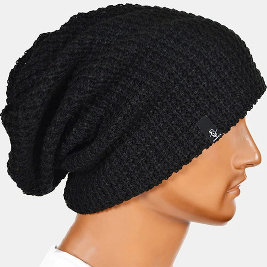Black solid knit slouch beanie by FORBUSITE, oversized unisex beanie hat with soft stretch, classic street style accessory for daily outfits