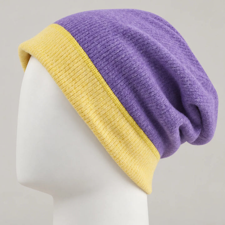 Purple BQ071 beanie with a yellow edge and relaxed shape on a head form