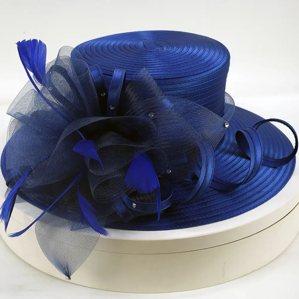 Royal blue satin wide brim church hat with layered mesh floral and ribbon loops