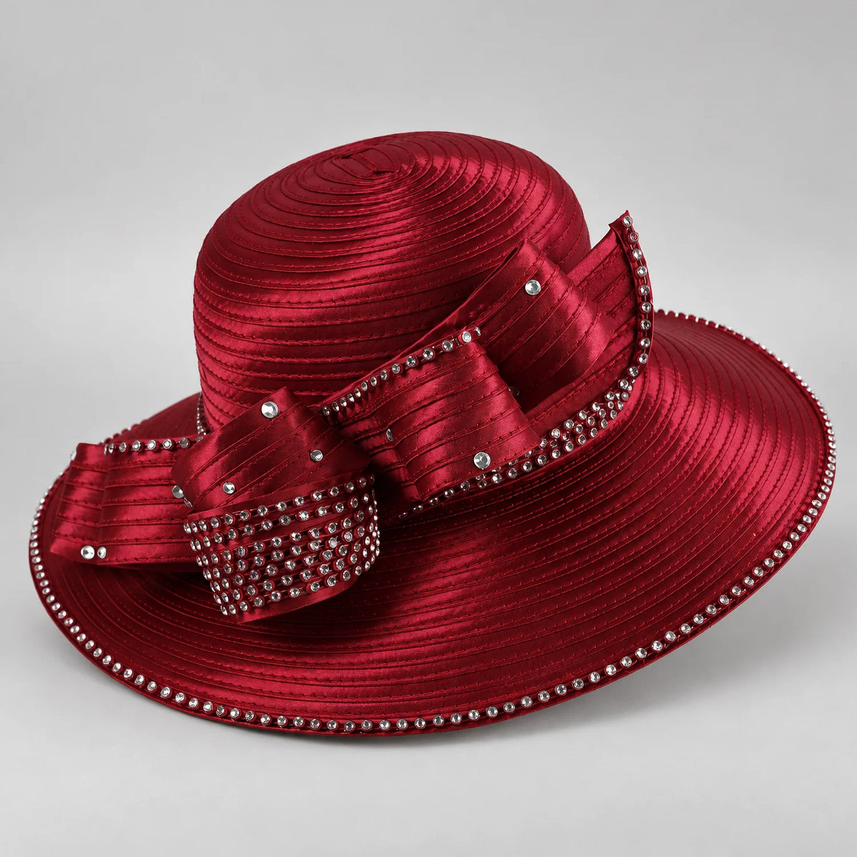Burgundy wide brim church hat for women with a sculpted satin ribbon bow, rhinestone-edged brim and concentric stitched bands