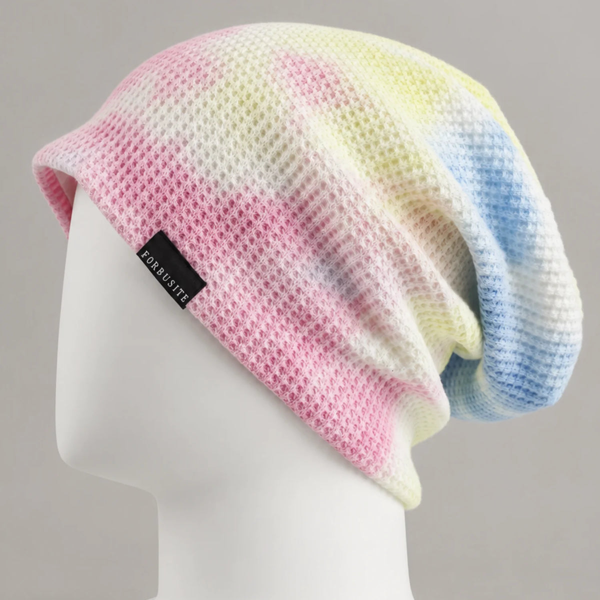 Pastel multicolor knit slouchy beanie with soft textured surface and relaxed drape