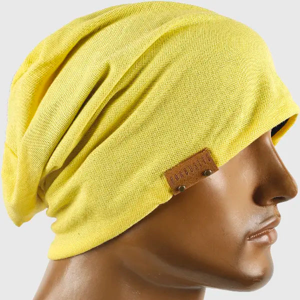FORBUSITE yellow slouchy beanie hat worn by model, oversized lightweight beanie cap with baggy fit, unisex street style for men and women, all season solid color outfit accessory