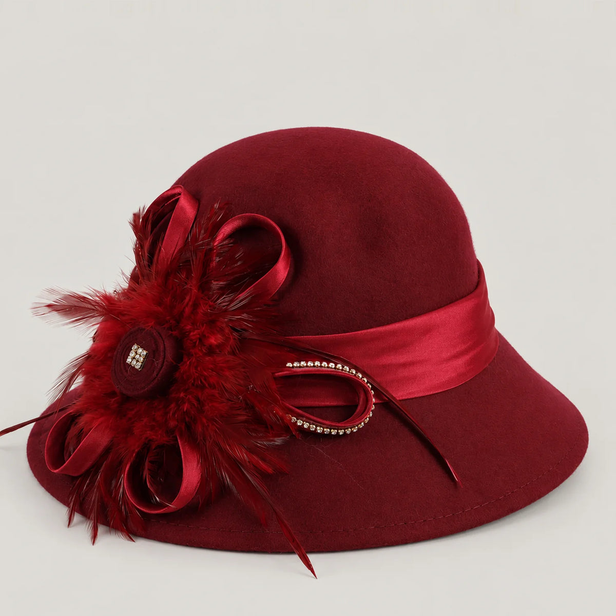 Burgundy wool church hat with matching feather and ribbon detail