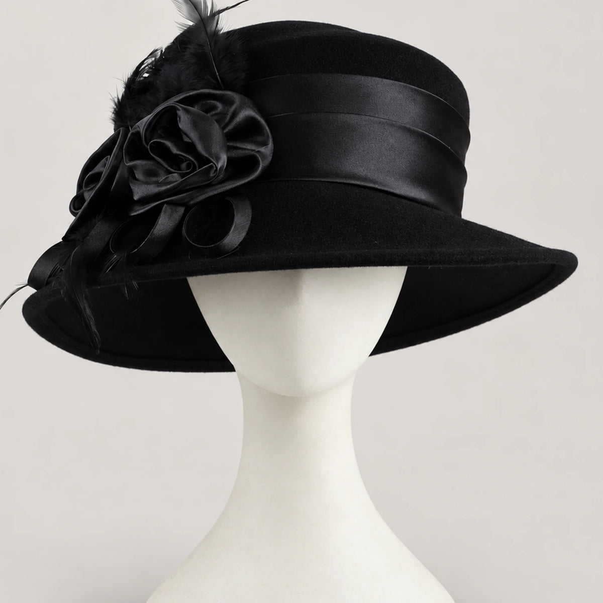 Black Z026H wool church hat with side ribbon flowers and feathers on a white mannequin
