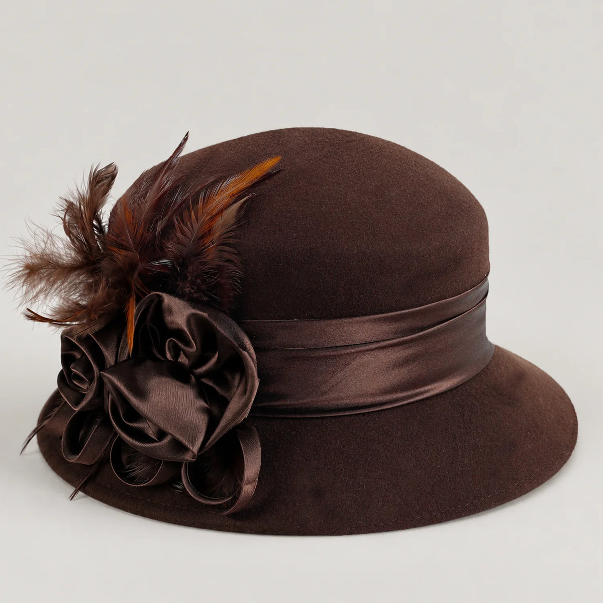 Brown Z026H dress hat showing its curved brim, ribbon band and side decoration