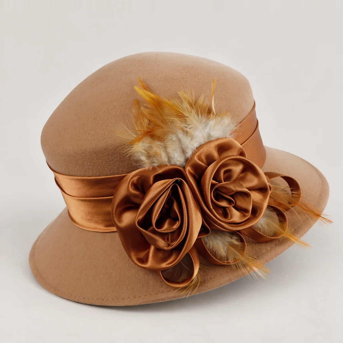 Side view of the camel Z026H hat showing the layered ribbon flowers and feathers
