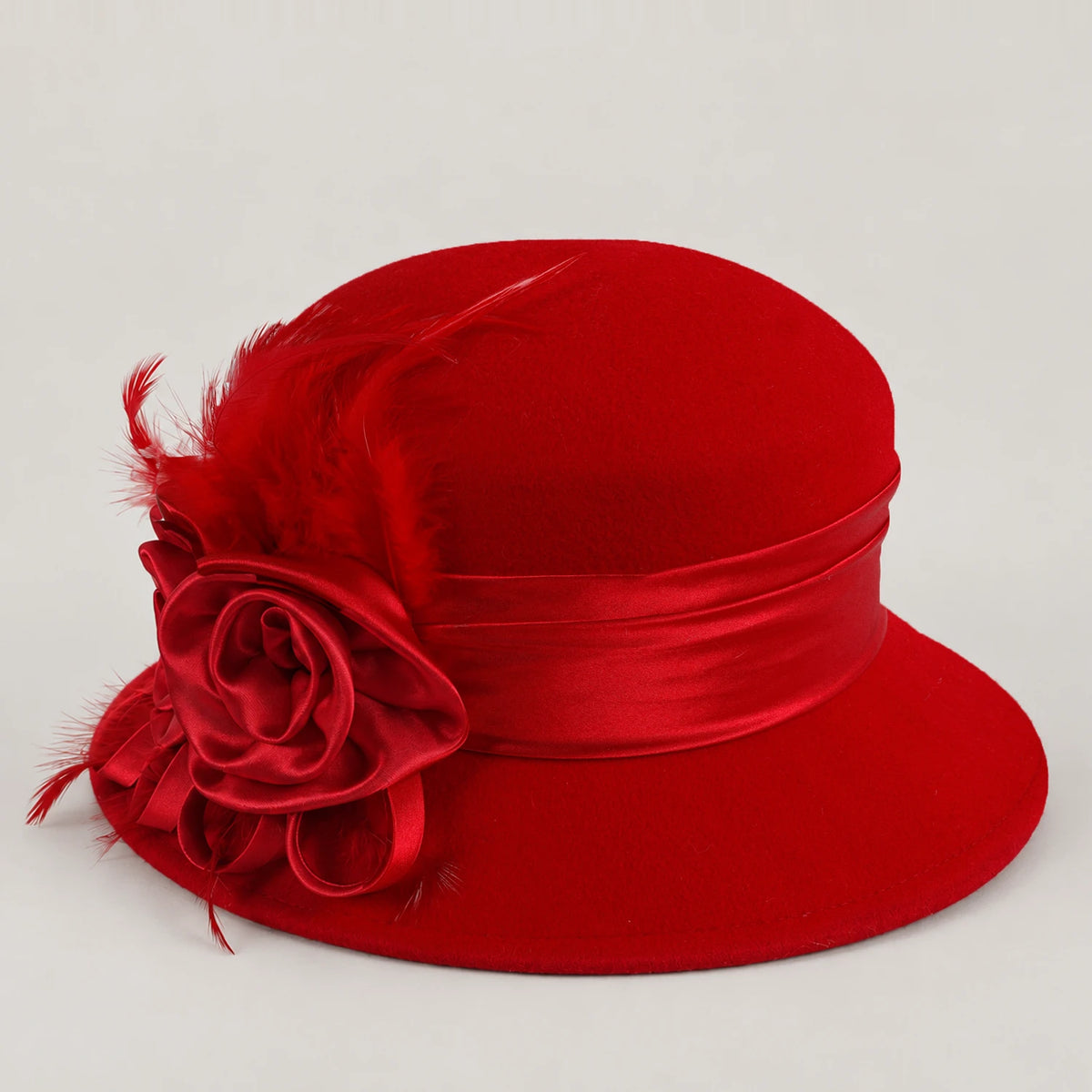 Red Z026H wool hat with ribbon flowers and feather accents, displayed without a mannequin