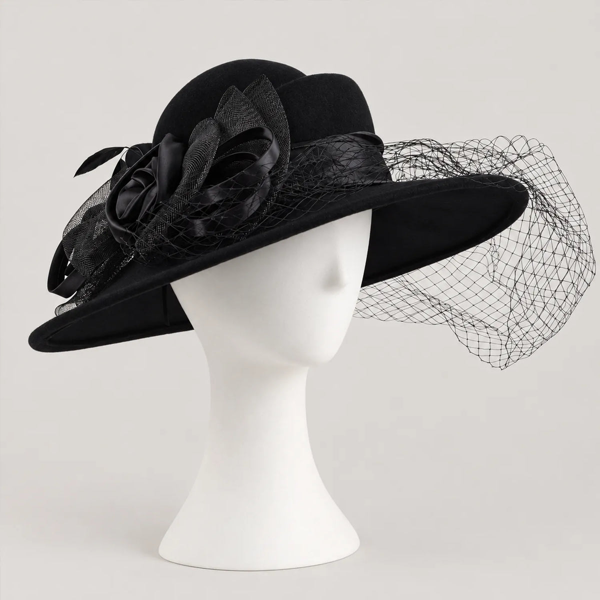 Black Z029B hat on a white mannequin with a side flower and mesh veil extending beyond the brim.