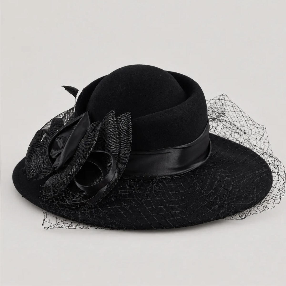 Black Z029B wide brim hat with layered flower trim and mesh veil in angled product view.