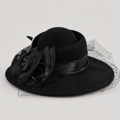 Black Z029B wide brim hat with layered flower trim and mesh veil in angled product view.