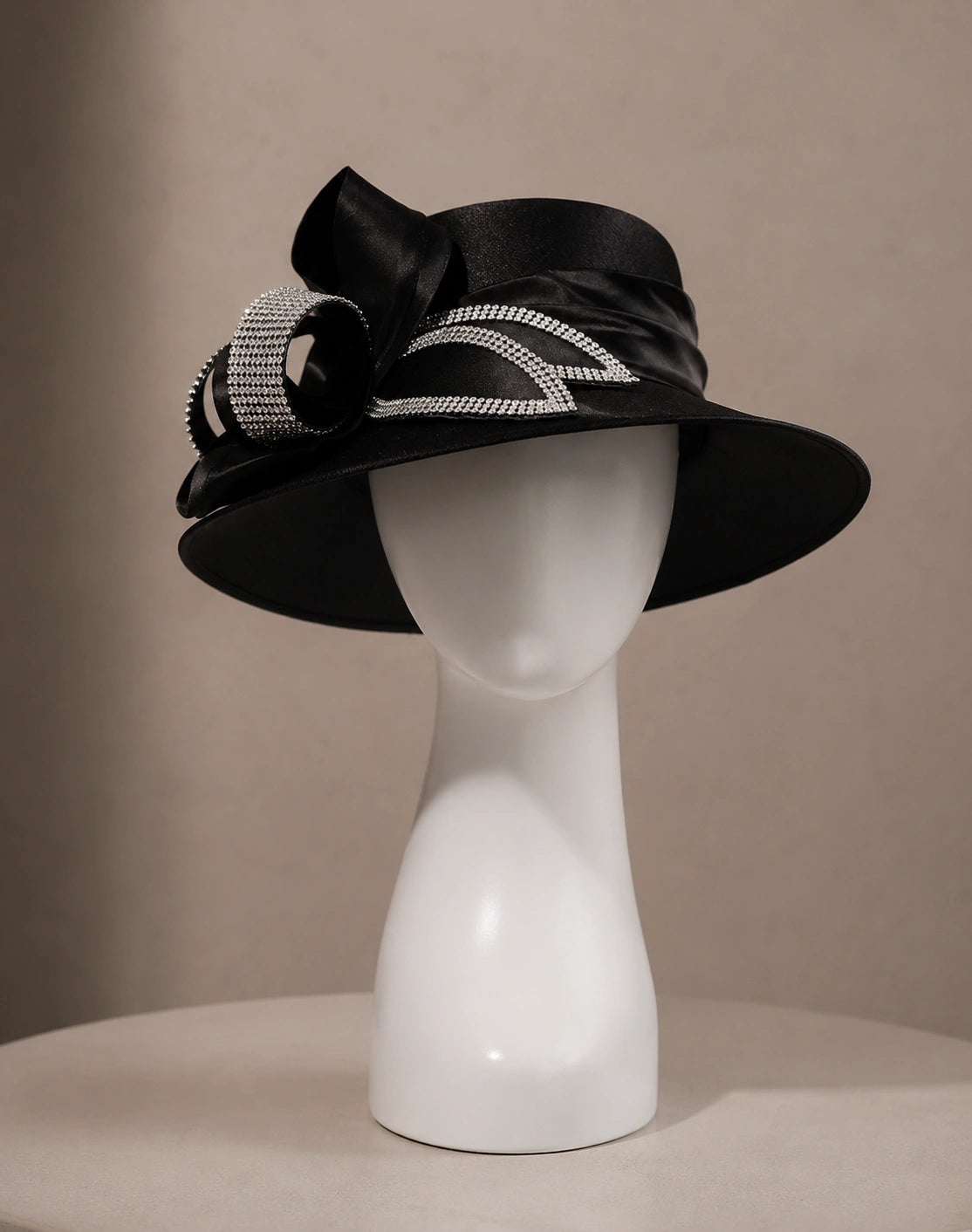 Formal black church hat for women with wide brim and rhinestone bow decoration