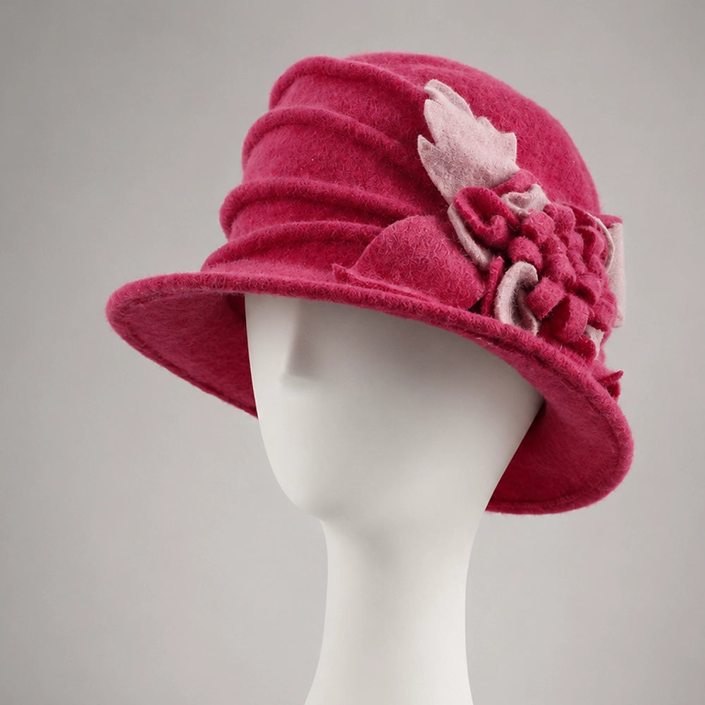 Fuchsia wool felt cloche hat with a contrasting pink floral decoration
