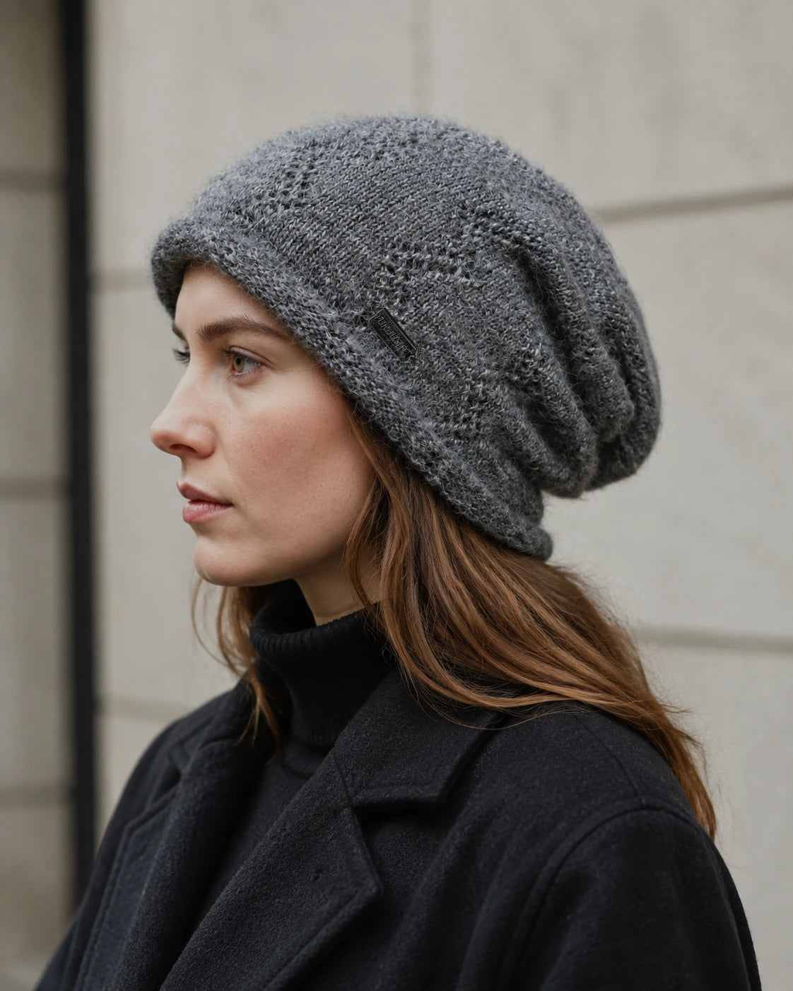 Woman wearing a gray fleece-lined slouchy beanie