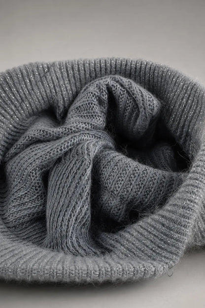 Interior fabric lining of a gray women’s knit visor beanie