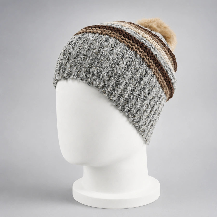 Gray striped knit pom pom beanie on a white mannequin