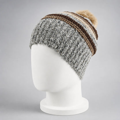 Gray striped knit pom pom beanie on a white mannequin