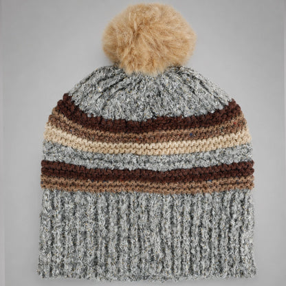 Gray striped pom pom beanie flat lay showing the non-cuffed opening