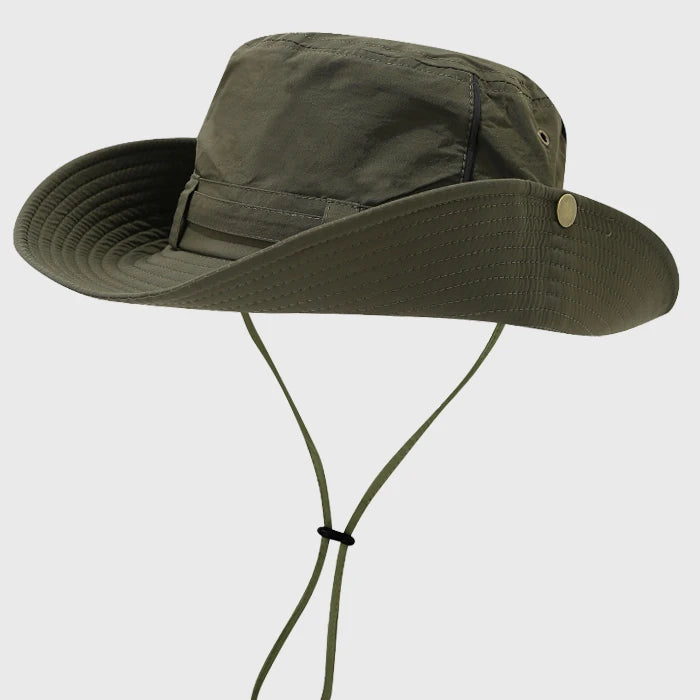 Green boonie hat with adjustable chin strap and wide brim, offering UV protection and comfort for fishing, hiking, and safari adventures.