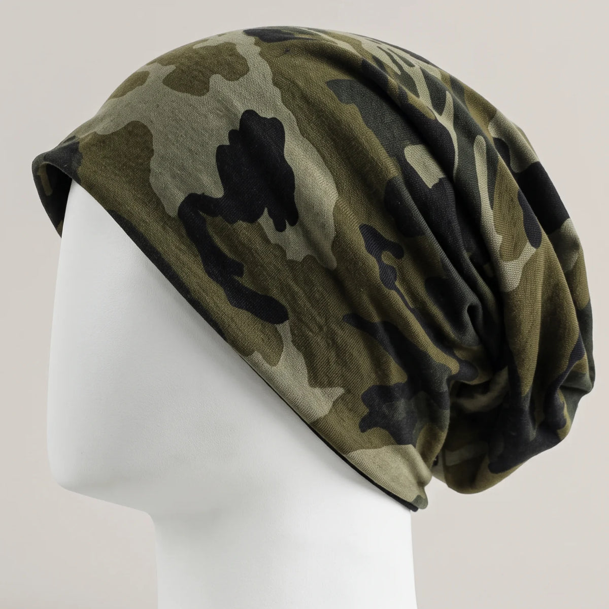 green camouflage slouchy beanie shown on a white mannequin