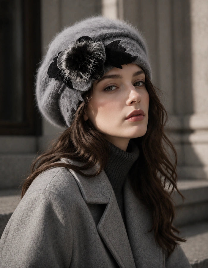 Grey angora wool beret with flower accent styled with grey coat for winter