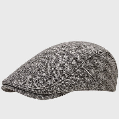 Grey flat cap with an Ivy cap design, perfect for both men and women. Made from POLYESTER fabric, ideal for adding a stylish touch to casual outfits