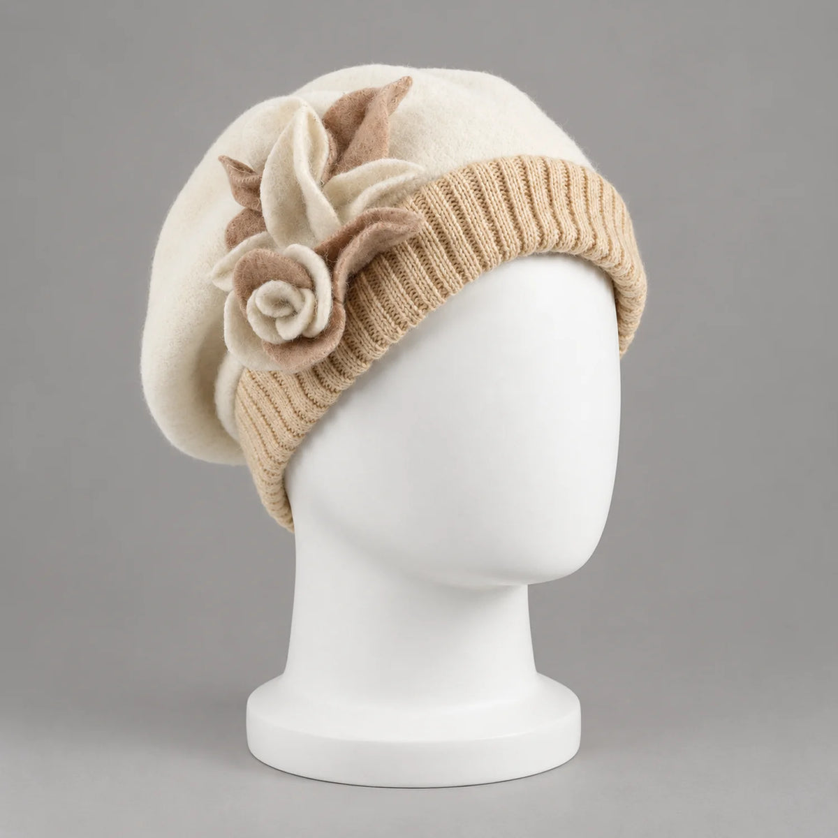 Cream floral beret on a white mannequin, three-quarter view
