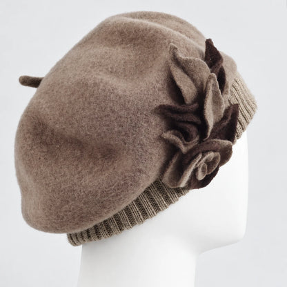 Side view of the taupe floral beret on a white mannequin