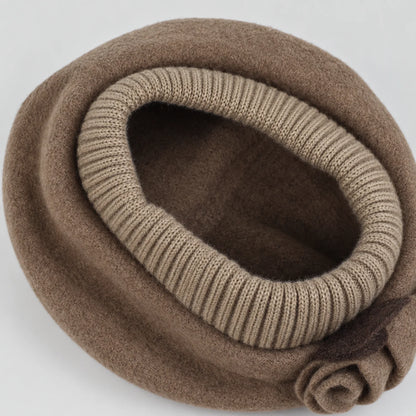 Interior of the taupe beret showing the unlined wool crown and rib-knit opening