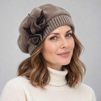 Woman wearing a taupe beret with a layered flower detail, viewed from the front and side